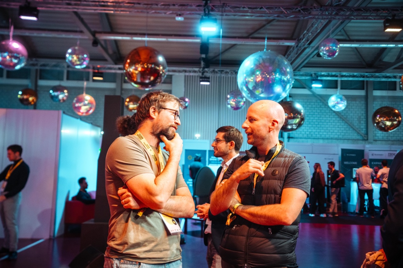 Sellers networking under hanging disco balls